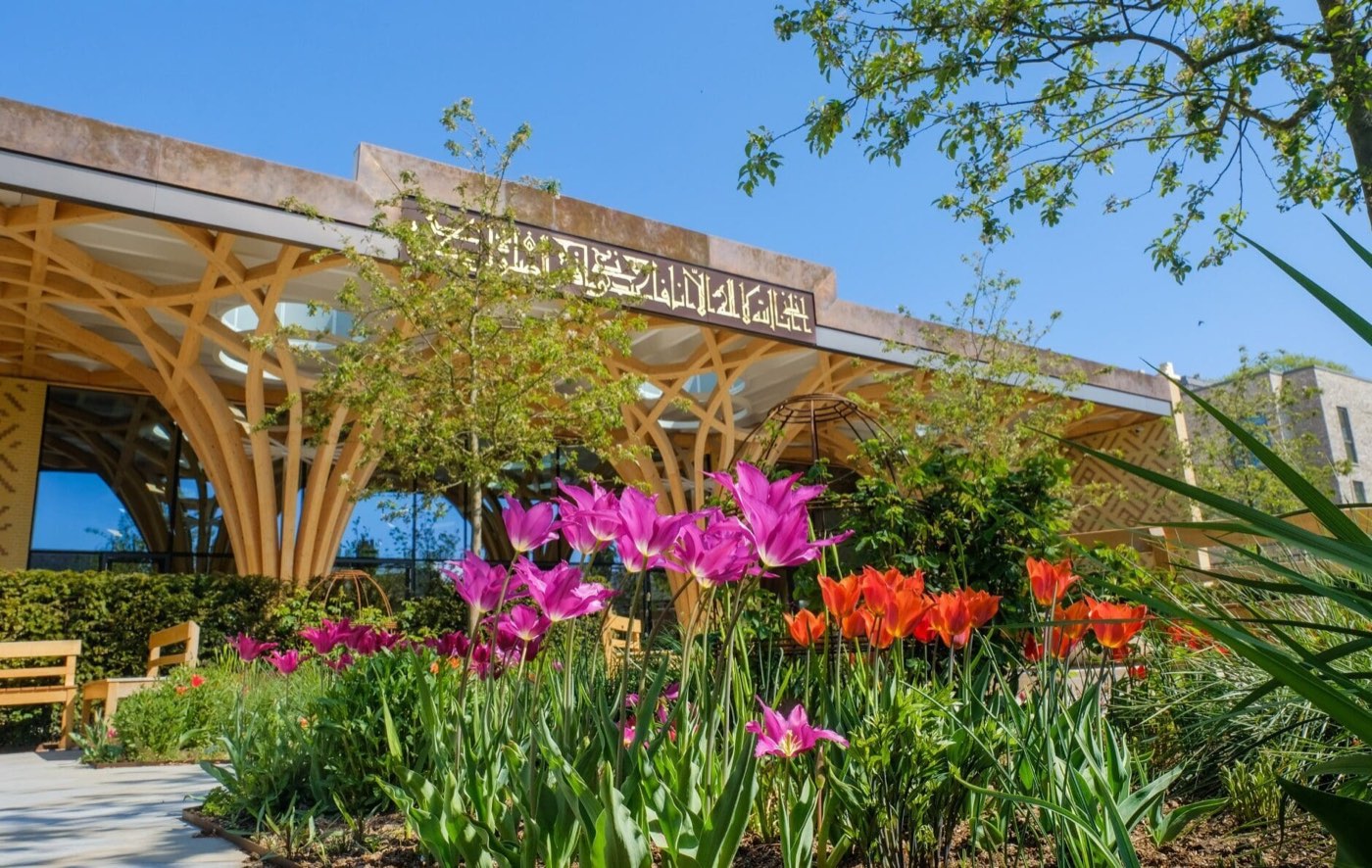 Tulips in the Islamic garden in front of the mosque's timber portico on a spring day